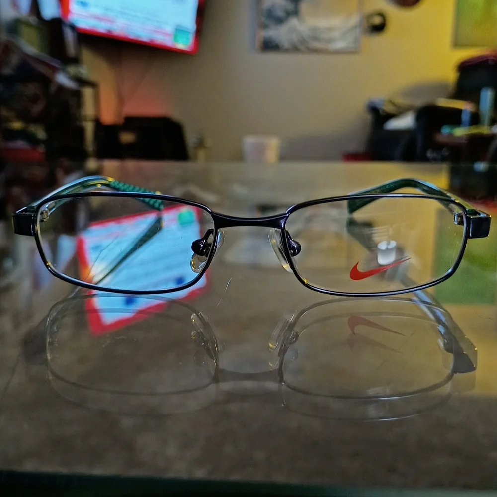 Nike Kids Black Frames with Teal Patterned Temples and Red Logo